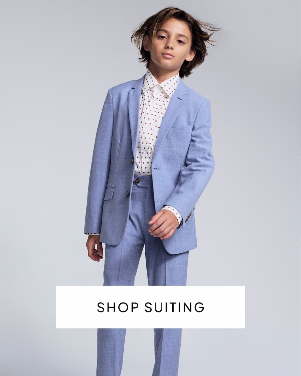 Boys wearing blue suit on grey background with text shop suiting