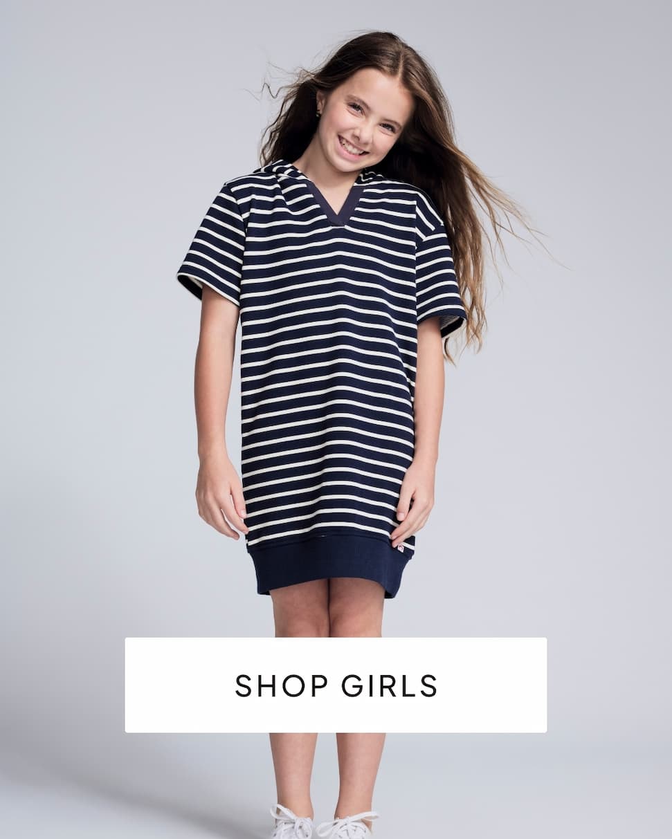 girl wearing blue dress on grey background with text shop girls