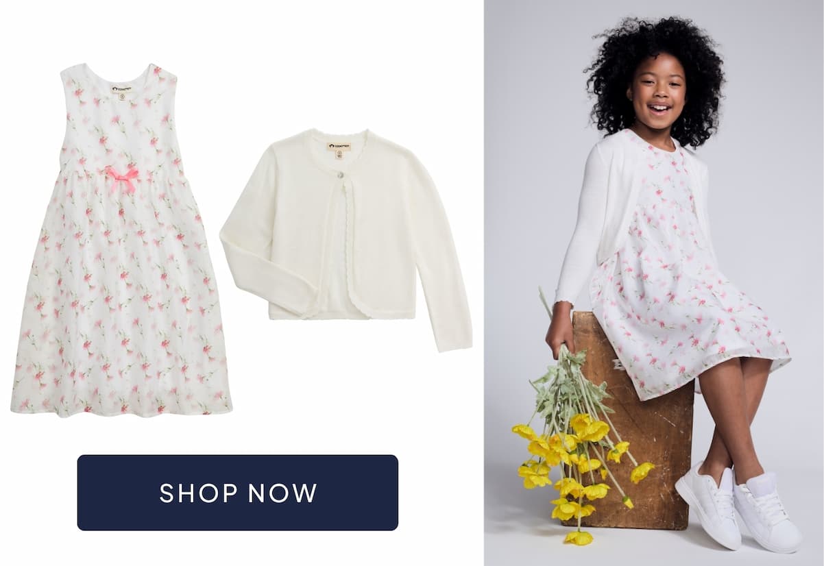 girl wearing floral dress and white cardigan with image of dress and cardigan and navy shop now button