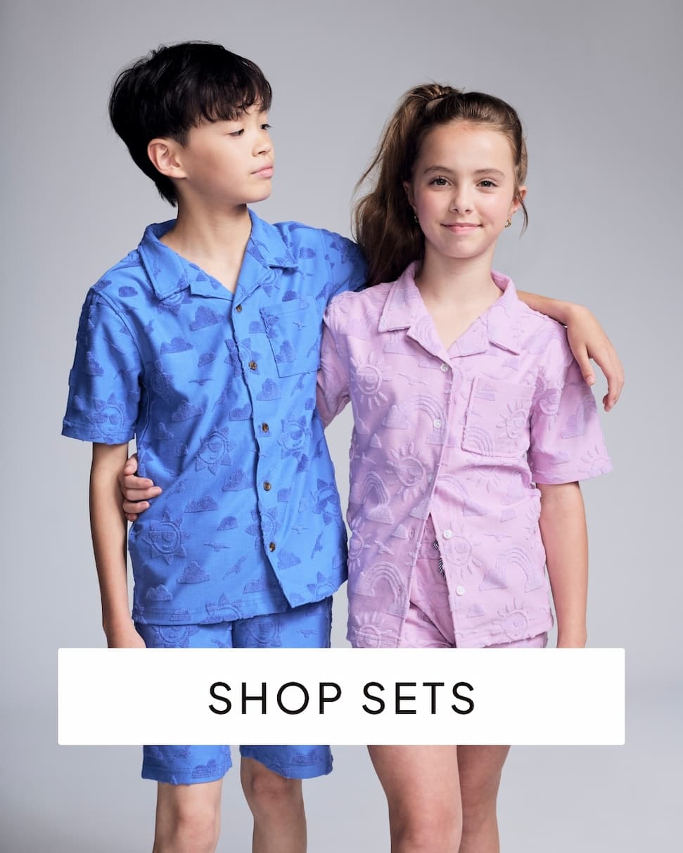 Boy and girl in terry sets with text shop sets