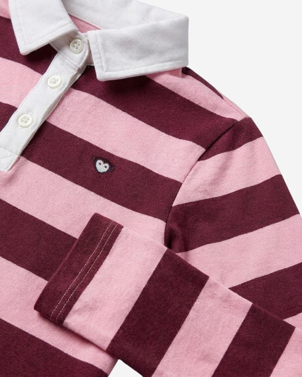 Close up of pink striped polo dress