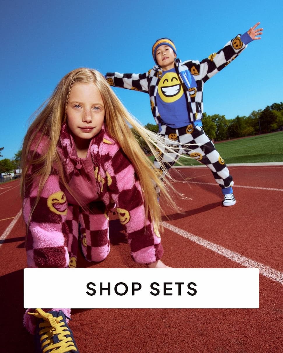 Kids outside wearing fleece sets with text shop sets