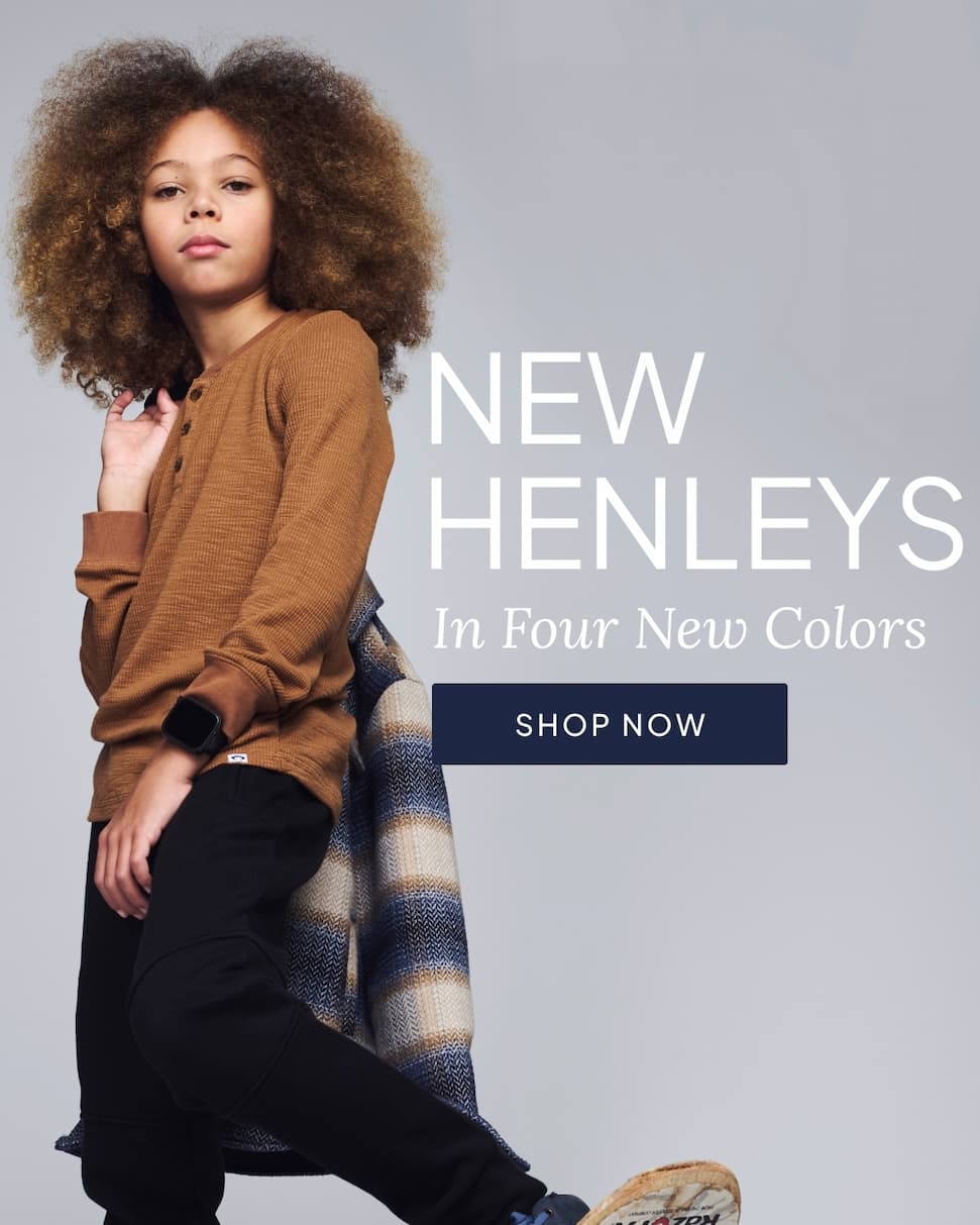 Boy wearing tan henley shirt with text new henleys in four new colors with shop now button
