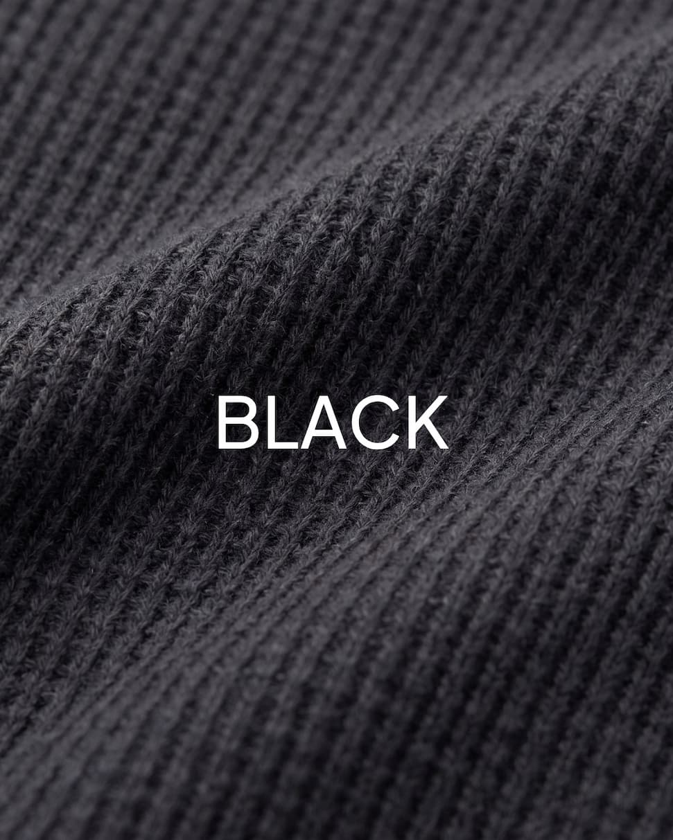 Boys black henley material close up shot