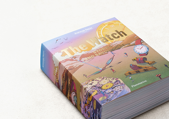 A photo of a large book titled The Watch – Stories and Savoir Faire, with a multi-coloured cover.