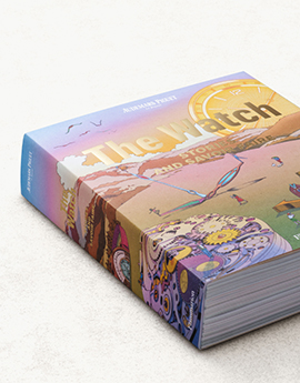 A photo of a large book titled The Watch – Stories and Savoir Faire, with a multi-coloured cover.