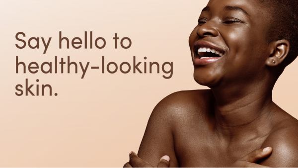 Image of woman applying the Aveeno Stress Relief Body Wash onto her upper arm.