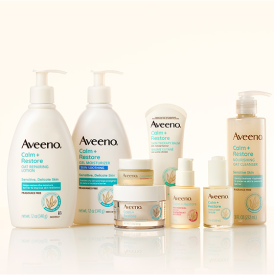 Image of all the Aveeno Calm and Restore Products Lined up on an oat beige background.