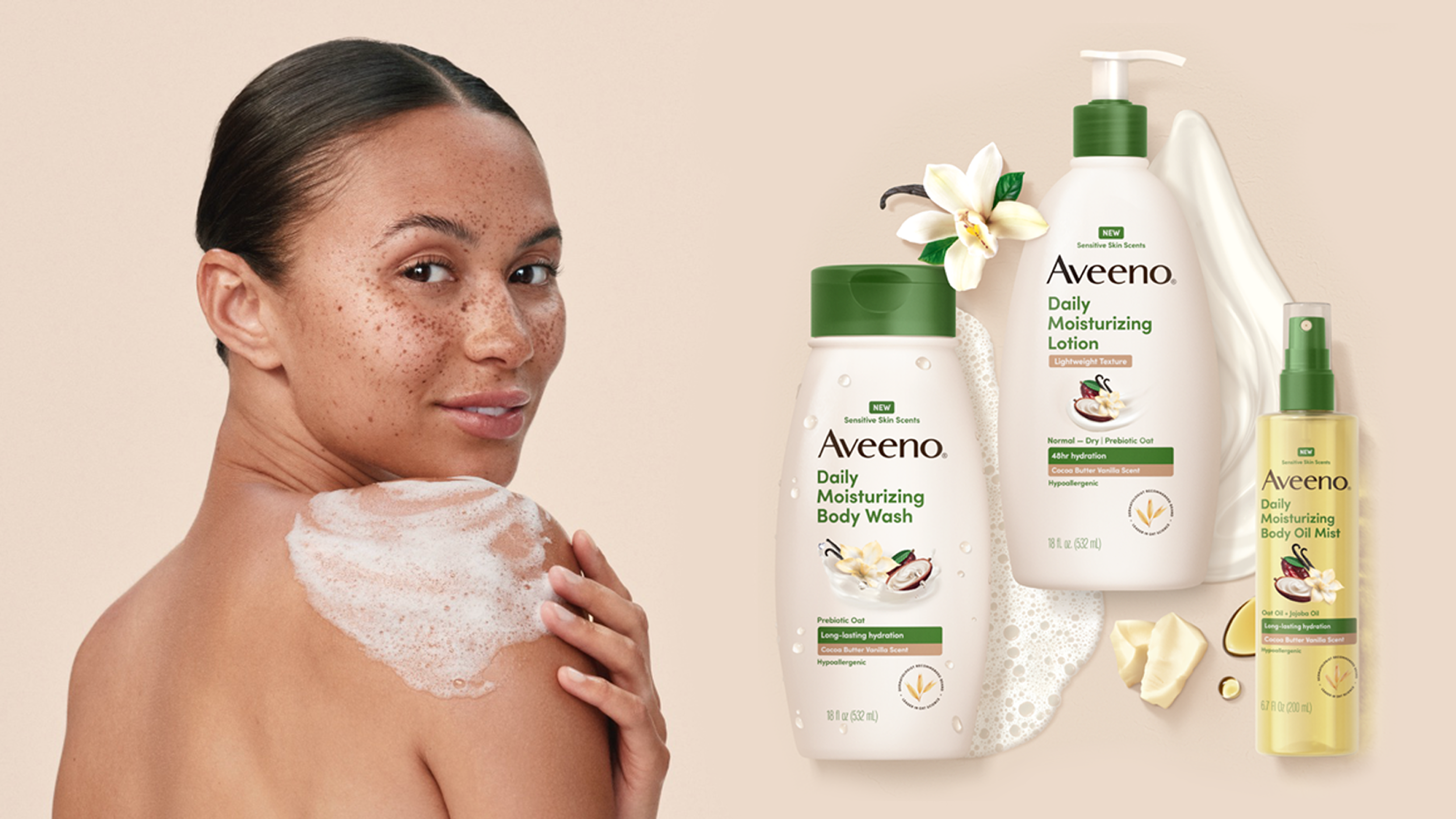 Woman with body wash applied on her shoulder and next to her is an assortment of products from the Aveeno® Daily Moisturizing Collection with NEW Sensitive Skin Scents
