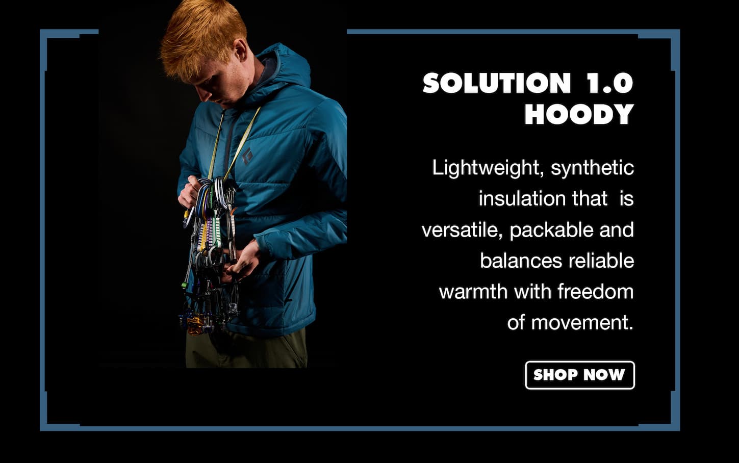 an image of a man holding a camera and wearing a blue jacket