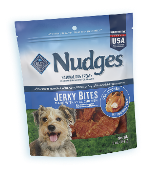 Blue Buffalo dog food treats under a festive banner.