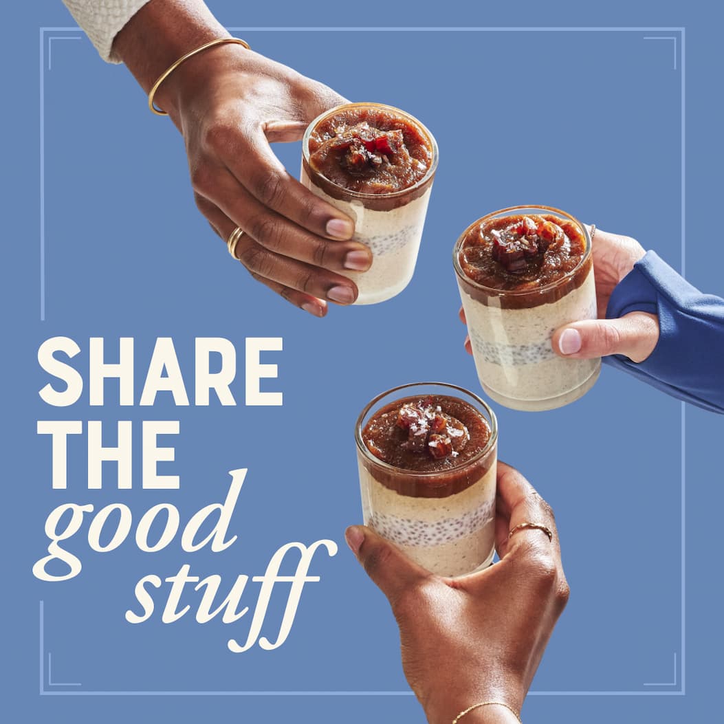 Share the good stuff. Image of three hands holding clear glasses full of Salted Date Caramel Chia Pudding