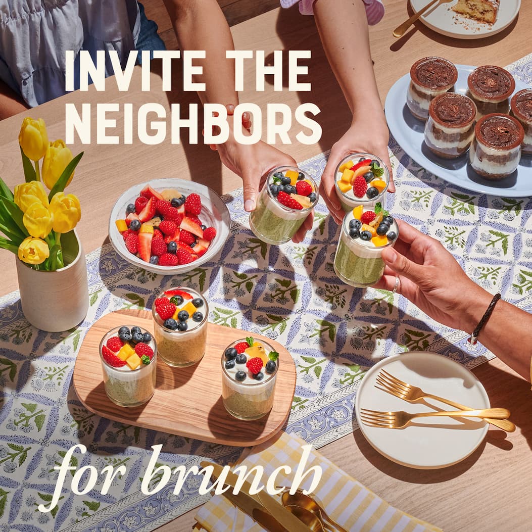 Invite the neighbors for brunch. Image of three sets of hands sharing oatmeal and fresh fruit.