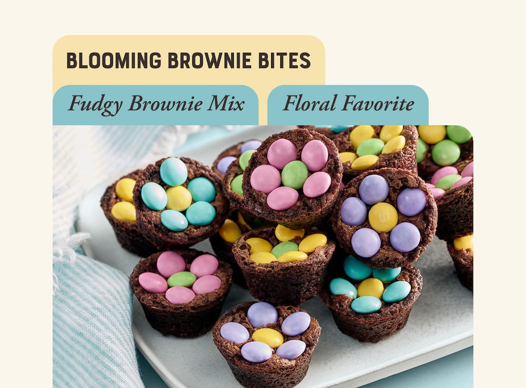 Blooming Brownie Bites. Image of mini brownies with candy decoration in the shape of flowers.