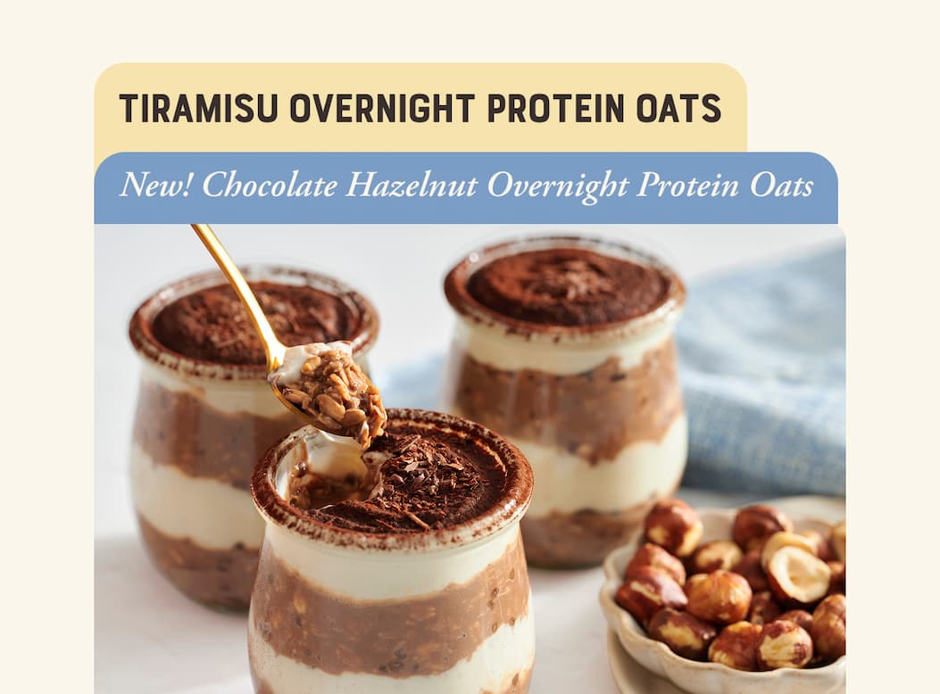 Tiramisu Overnight Protein Oats. Image of single serve oats in glass jars with chocolate and hazelnuts.