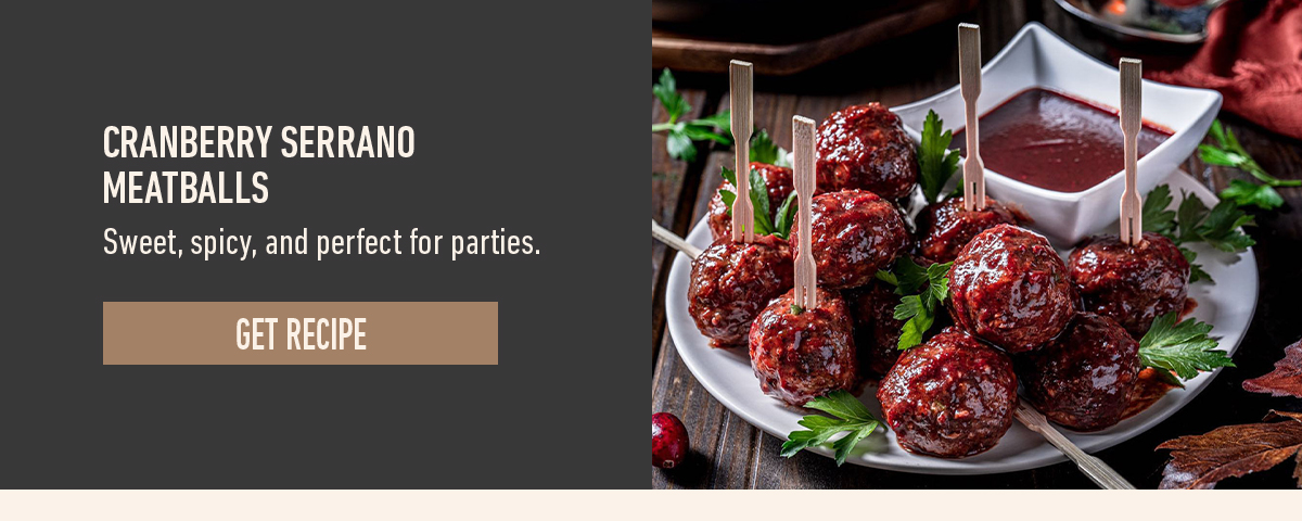 Cranberry serrano meatballs on a plate with dipping sauce and Get recipe button inviting users to view the recipe.