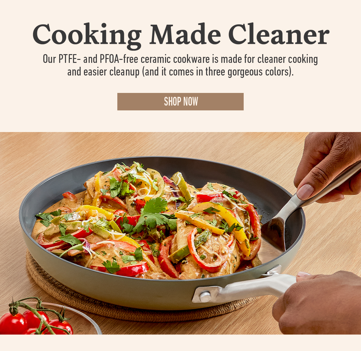 Text about cleaner cooking cookware and a shop now button. Image shows hands holding a pan with cooked vegetables and chicken.