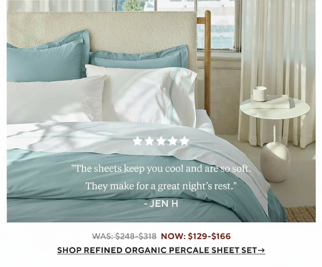an image of a bed with a blue comforter and pillows
