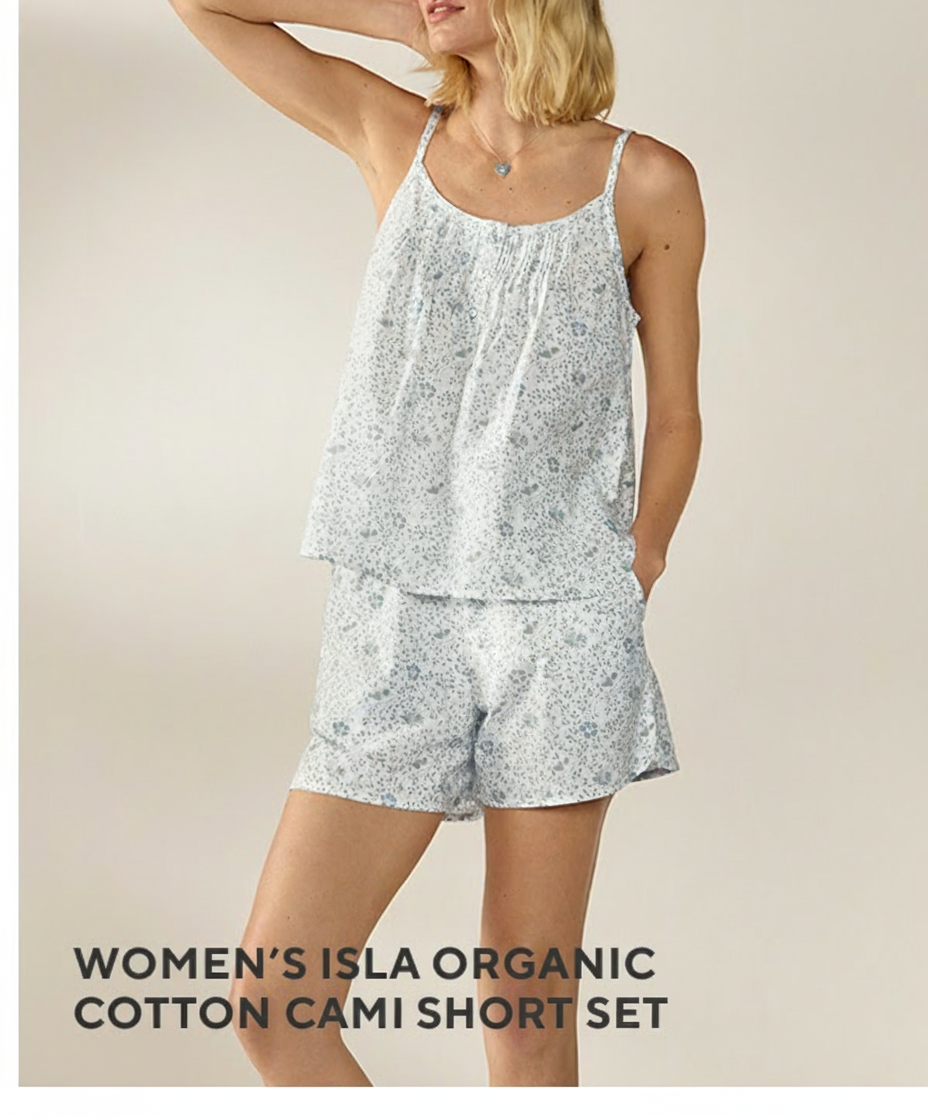 an image of a woman wearing a white and blue floral print pajamas