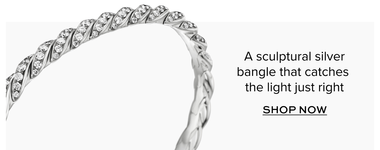A sculptural silver bangle that catches the light just right. Shop Now