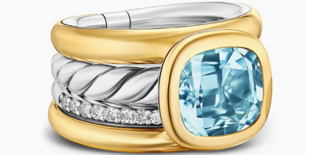 A stacked statement ring with a glowing topaz center stone