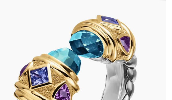 A vibrant ring framed in blue topaz, iolites, and amethysts