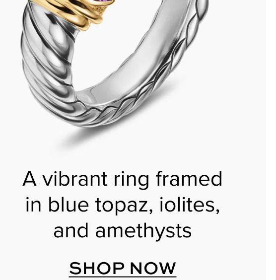 A vibrant ring framed in blue topaz, iolites, and amethysts