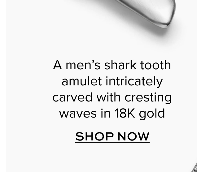 A men's shark tooth amulet intricately carved with cresting waves in 18K gold. Shop Now.