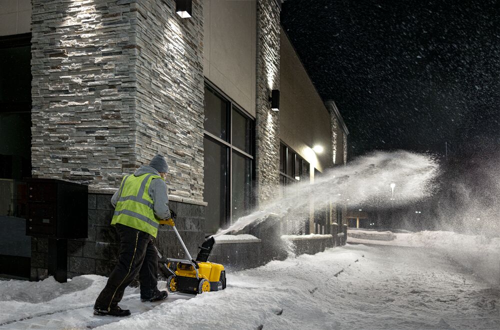 DEWALT Single-Stage Snow Blower blowing snow