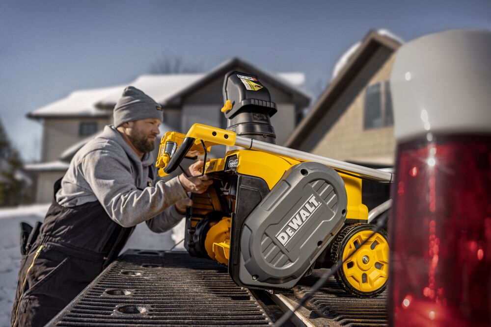 DEWALT Single-Stage Snow Blower loading onto truck