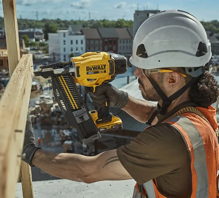 DEWALT 60V MAX* worm drive style saw ripping through wood sheets