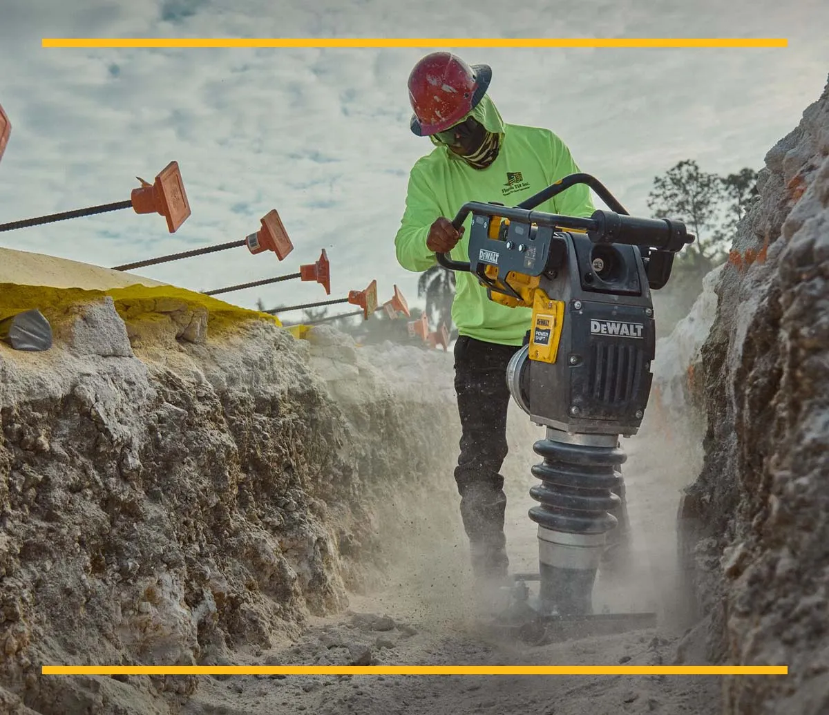 DEWALT POWERSHIFT rammer being lifted by machine