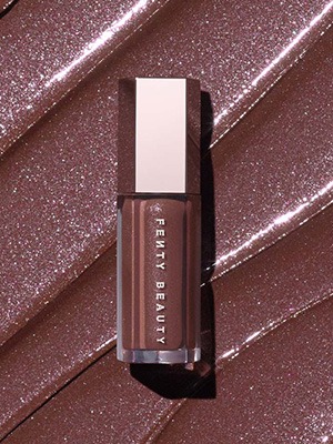 RIHANN'S NEW FAVE GLOSS BOMB SHADE Lock lips with 'Rose Amber,' a shimmering cool taupe brown shade that looks good on everyone. GLOSS BOMB