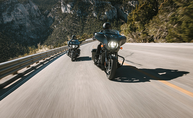 Two Indian Motorcycle Riders Riding through the mountains