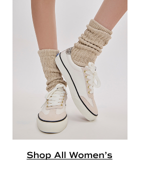 A pair of Jump Kick T-Toe Leather/Suede Hair Calf Heel Lace-Ups in off white/beige shown onfoot paired with tan scrunched socks. Shop All Women’s.