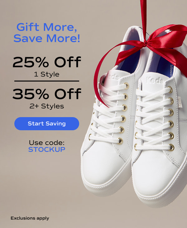 A grey background with a pair of the Jump Kick Duo Leather Lace-Ups in white tied with a red bow. The email says Gift More, Save More! 25% Off 1 style, 35% Off 2 or more styles. Exclusions apply. Use code: STOCKUP. Start Saving.
