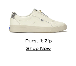 A side view of the Pursuit Zip Leather Dalmata Heel in egret/black. Shop Now.