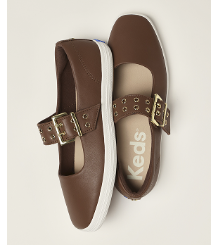 A top-down view of a pair of Square Toe Mary Jane Leather Grommet Buckle flats in brown.