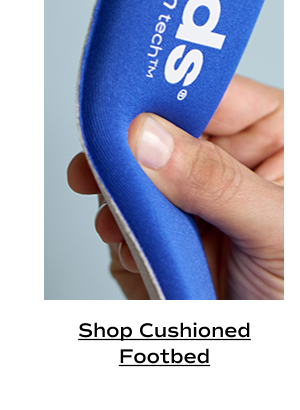 A closeup of a hand pressing into the plush cushioning of the BlissFoam Tech footbed featured in all BlissWalk styles. Shop Cushioned Footbed.