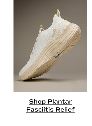 The BlissMove Knit Slip-On in snow white/parchment shown from the side with the toe positioned on the floor, heel in the air. The angle showcases the sneaker’s sculpted midsole. Shop Plantar Fasciitis Relief.