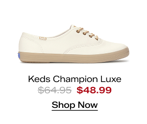 A side view of the Keds Champion Luxe Leather Round Laces Lace-Up in snow white/Irish cream which was $64.95 and is now $48.99 for a limited time. Shop Now.