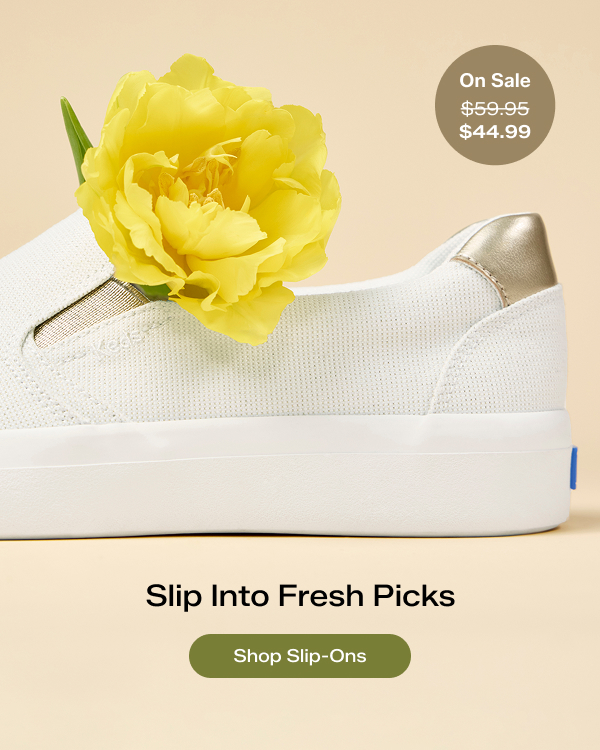 A partial side view of the Pursuit Lurex Linen Slip-On in snow white/gold with a yellow flower tucked into its opening. Text on the image says Slip Into Fresh Picks. A callout on the image notes that the style was $59.95 and is now $44.99 for a limited time. Shop Slip-Ons.