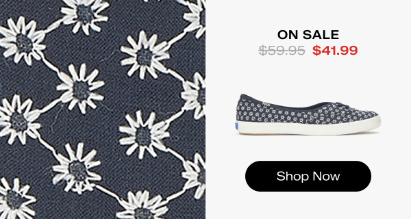 A side view of the Mini Daisy Eyelet Slip-On in navy on the right and a close-up of the daisy eyelet fabric on the left. The style was $59.95 and is now on sale for $41.99. Shop Now.