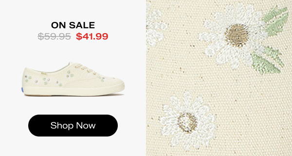 A side view of the Keds Champion Canvas Floral Embroidery Lace-Up in egret on the left and a close-up of the embroidered fabric on the right. The style was $59.95 and is now on sale for $41.99. Shop Now.