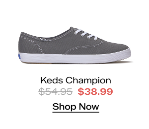 A side view of the Keds Champion Canvas Lace-Up in gray. The style was $54.95 and is now $38.99 for a limited time. Shop Now.