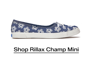 A side view of the Rillax Champ Mini Chambray Floral Embroidery Slip-On in light blue. Shop Now.