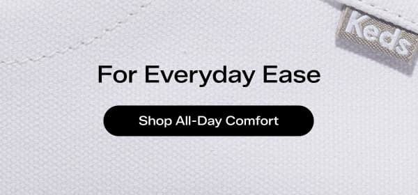 A close-up of Keds' white canvas. The text says For Everyday Ease. Shop All Day Comfort.