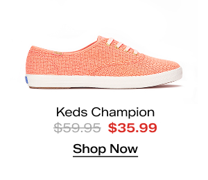 A side view of the Keds Champion Cotton Mesh Lace-Up in neon coral. The style was $59.95 and is on sale for $35.99. Shop Now.