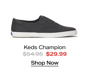 A side view of the Keds Champion Twill Round Toe Slip-On in charcoal. The style was $54.95 and is now $29.99 for a limited time. Shop Now