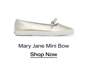 A side view of the Square Toe Mary Jane Leather Mini Bow in champagne/silver. Shop Now